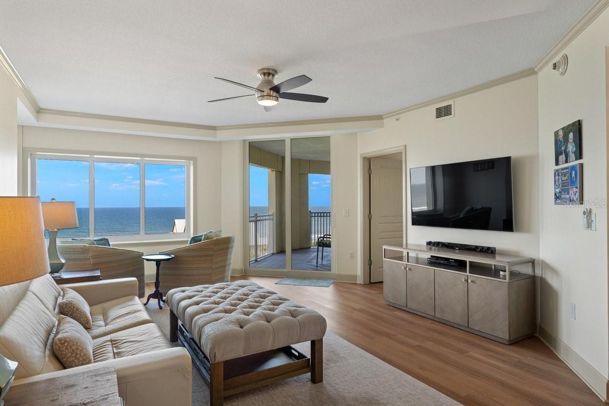 Expansive ocean views become the backdrop of the family room, creating a space that feels both peaceful and endlessly inviting.