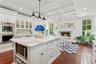 a chef's kitchen with fireplace