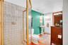 The full bath next to the office offers access to the kitchen as well as the outside.