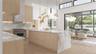 The chef’s kitchen showcases full-height millwork, professional-grade appliances, and an illuminated stone backsplash for a crisp, architectural finis