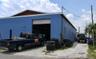Overhead garage doors on the side of the building
