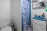 Bathroom with a stall shower and vanity