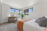Bedroom featuring wood-style f
