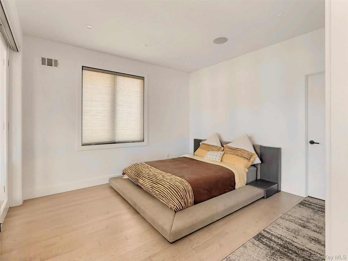First floor bedroom space with sliding door access to living area