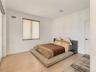 First floor bedroom space with sliding door access to living area
