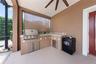 Outdoor kitchen w/ new grill.