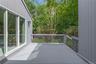 Expansive grey painted wood deck featuring a railing system.