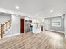 Unit 2 -Kitchen /Dining with exit to the deck and backyard