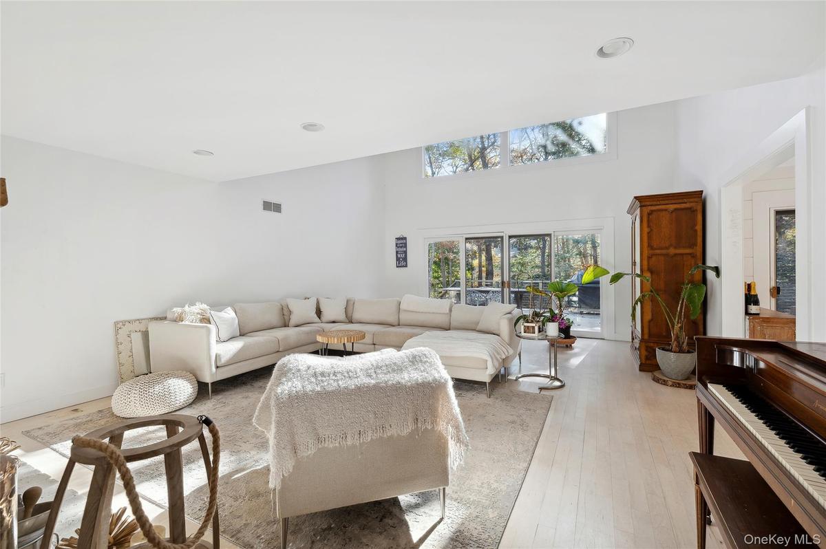 Living room with light hardwood / wood-style floors