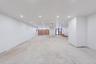Unfurnished room featuring unfinished concrete floors and recessed lighting