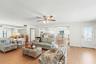 Enjoy the second level with its open design concept with a combined living room, kitchen, large dining room, and fireplace.  Large picture windows are