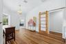 Barn door separating 2 bedrooms and bathroom
