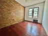 Empty room with radiator heating unit and wood finished floors