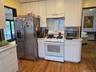 Upgraded kitchen with gas stove.