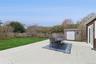 Fenced backyard featuring a patio, a shed, and outdoor dining area
