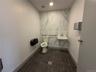 Bathroom featuring recessed lighting and dark tile patterned flooring