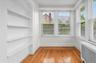 Bright and sunny heated sunroom with that can also be used as a home office, or 1st floor bedroom.