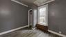 Unfurnished room with radiator and hardwood / wood-style floors