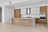 Kitchen W/ Wolf and Sub-Zero appliances, gas cooktop, double oven, and ample cabinetry.