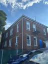 View of property exterior featuring brick siding