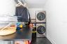 Primary bedroom closet with convenient laundry room built in!