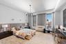 Bedroom with an inviting chandelier and recessed lighting