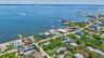 Waterfront property featuring direct access, a private dock, and a sandy shoreline