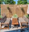 Paved patio surface with a decorative lattice privacy fence