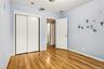 Unfurnished bedroom with a closet and light wood finished floors