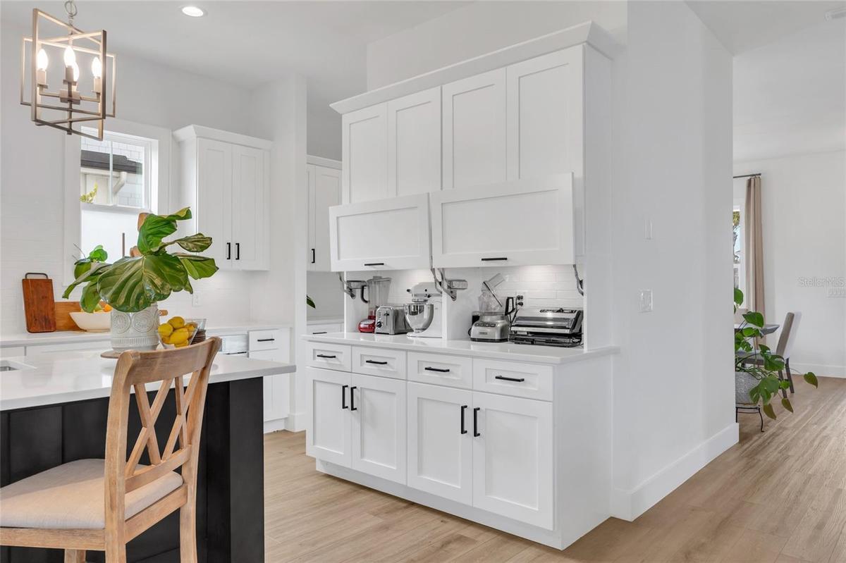 Elegant appliance garage keeps countertops beautifully organized while providing convenient access to every day essentials