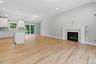 The open-concept layout seamlessly connects the living room, dining area and kitchen, creating an ideal space for everyday living and entertaining.