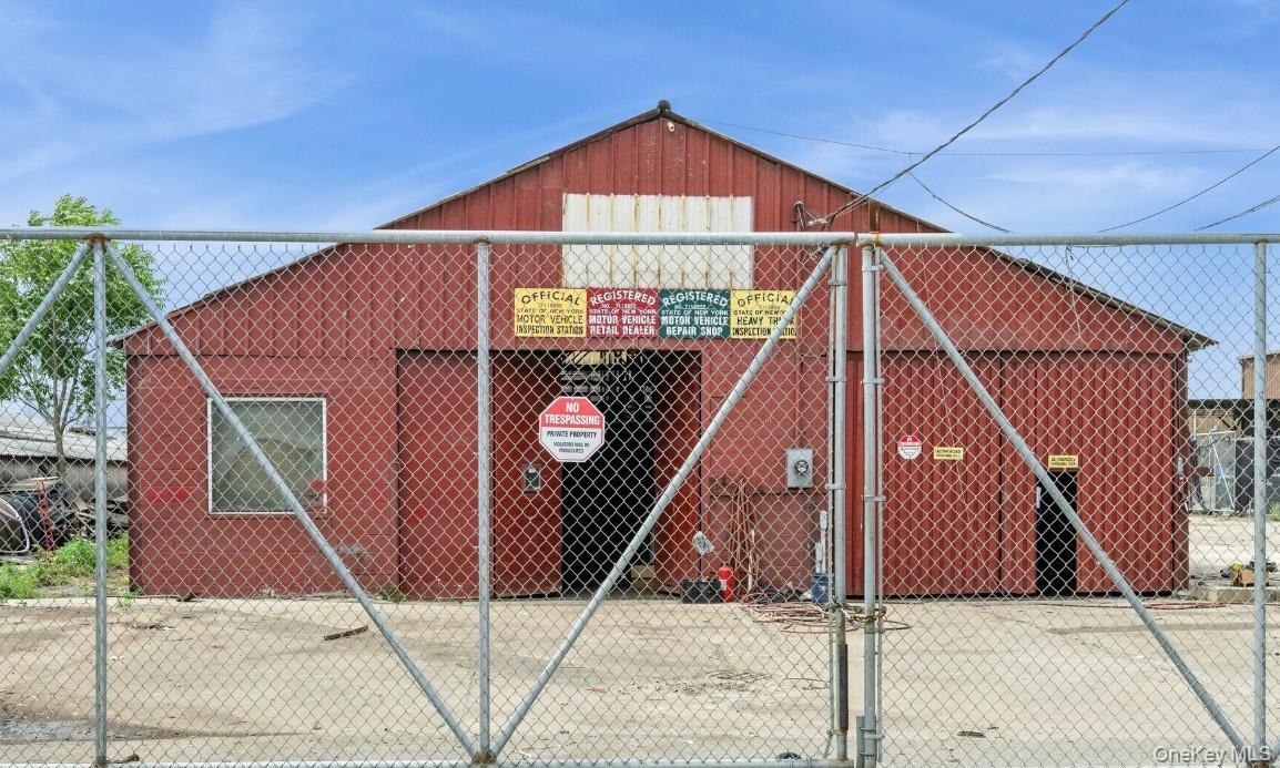 View of outdoor structure with a gate