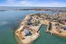 Bird's eye view featuring a view of the beach and a water view