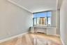 Unfurnished office featuring built in desk and crown molding
