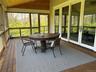 Enjoy a cup of coffee in the morning or a cocktail in the afternoon in screened in porch