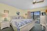 Primary bedroom with balcony access