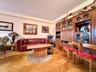 Elegant herringbone hardwood floors, open to the dining area that has a double panel window