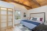 Bedroom featuring wood ceiling and wood finished floors