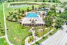 Community Center featuring a resort style pool with a beach entry, mushroom water fall and slide as well as a gym, playground, basketball court, socce