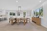 Recessed lighting, wood-finish flooring, a contemporary linear chandelier, multiple large windows, and white walls