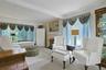 The Living room offers an abundance of sunlight, and a beautiful fireplace as well.