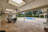 Step outside and discover your own PRIVATE OASIS where a  brick paver patio surrounds a sparkling in-ground pool, creating the perfect place to soak u