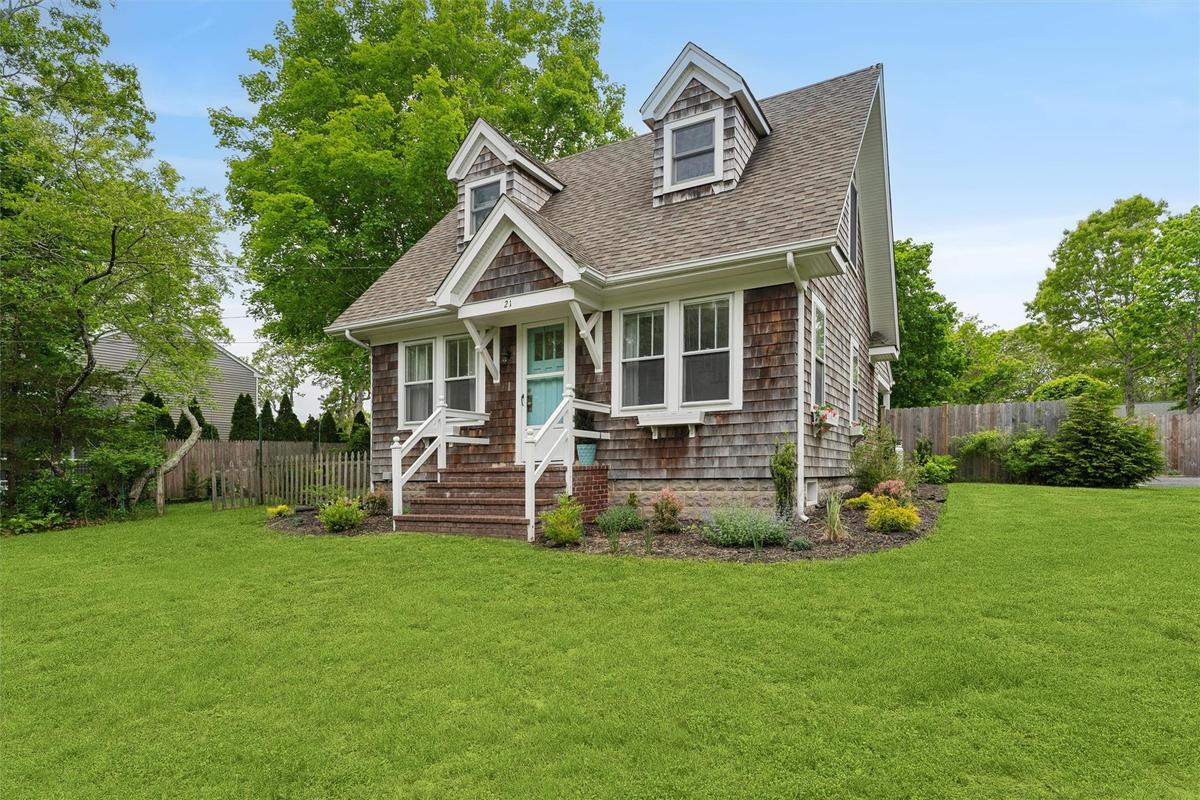 View of front of property with roof with shingles