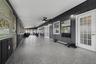 oversized 50'5"x14'10" screened back porch w/2 ceiling fans