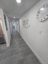 Hallway to bedrooms, baths and storage closet.