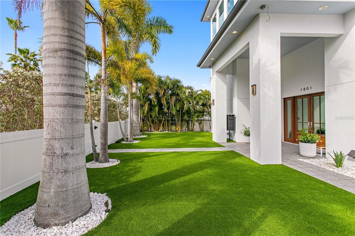 New turf and mature landscaping in front yard