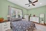 Primary bedroom with a soothing ambiance and great natural light.