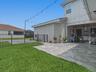 Large Lanai with plenty of fenced green space!