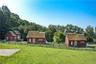 3 1-bedroom guest cottages with thatched roofs.