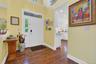 Foyer featuring recessed lighting, healthy amount of natural light, and dark wood finished floors
